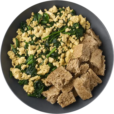 Tofu brouillé aux épinards et morceaux de pain complet